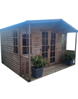 Kelmarsh summer house with double doors and six pane Georgian fixed windows on wooden decking by IN Sheds